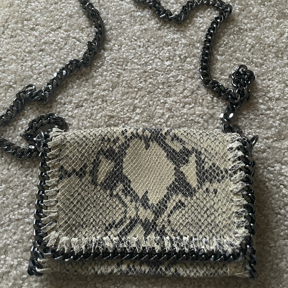 Made in Italy. Leather bag alligator skin with chrome chain and zipper